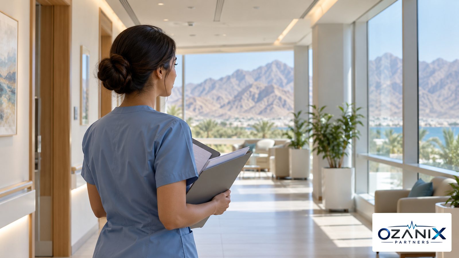 A healthcare professional with a folder of certificates in a bright clinic corridor in the Northern Emirates
