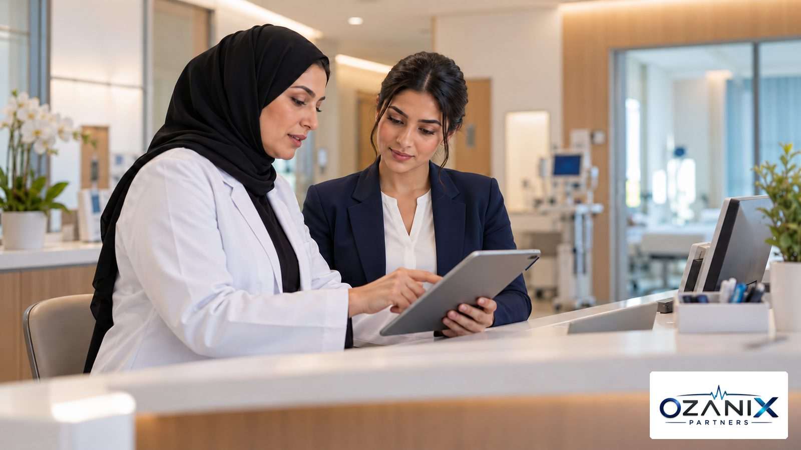 A clinic doctor and a quality manager reviewing an incident report on a tablet at a reception desk